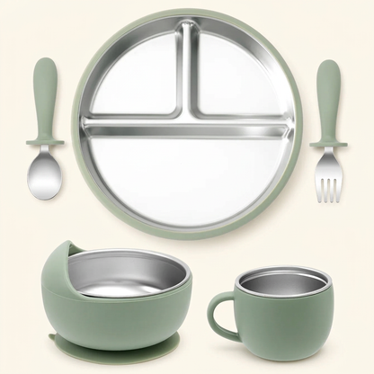Sage stainless steel and silicone baby feeding set on ivory
