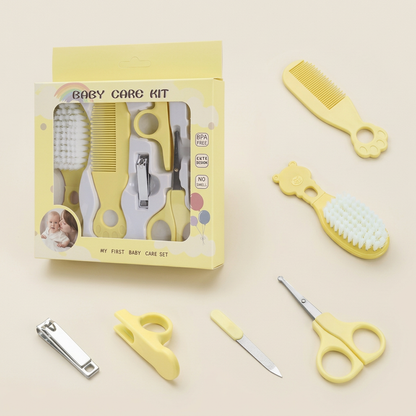 Yellow baby grooming kit on a warm ivory background