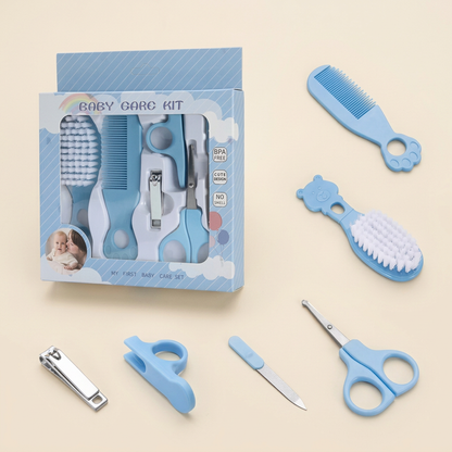Blue baby grooming kit on a warm ivory background